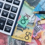 Australian money, calculator, pen. Photographed by RomanR. Image via Shutterstock