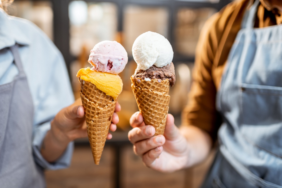 Two ice creams in cones. Photography by RossHelen via Shutterstock