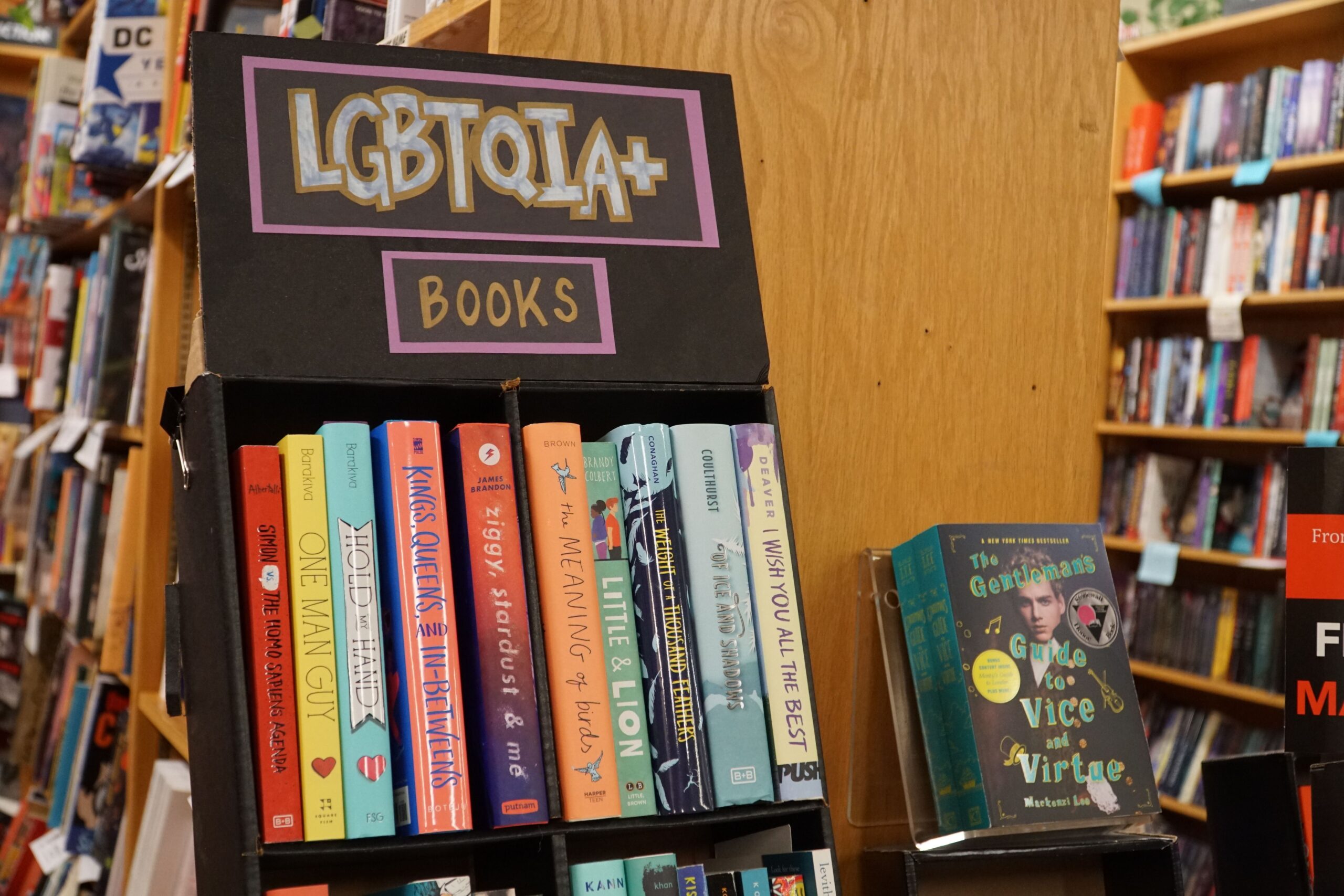 LGBT+ books in bookstore. Photography by Michael Barajas. Image via Shutterstock