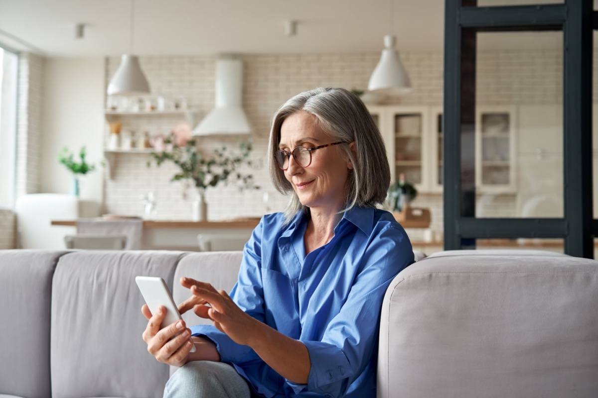 Relaxed older women on phone. Photography by Ground Picture. Image via Shutterstock