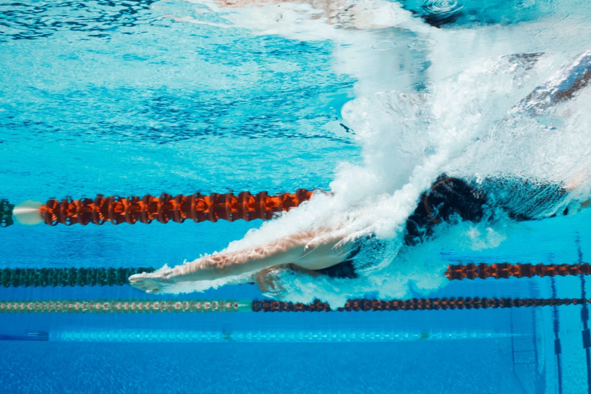 Person swimming. Photography by KOTOIMAGES. Image via Shutterstock