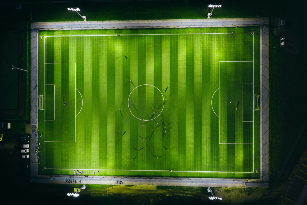 Bird's-eye view of soccer field. Photography by Izuddin Helmi Adnan via Unsplash