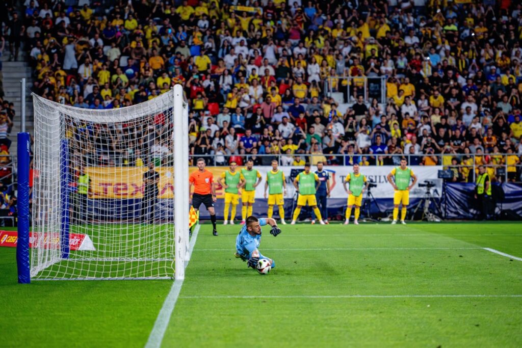 Shooting goal into soccer. Photography by Cristi Mitu via Shutterstock