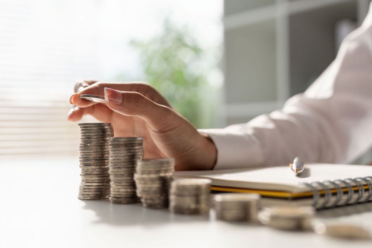 Stacks of coins. Photography by Natee Meepian. Image via Shutterstock