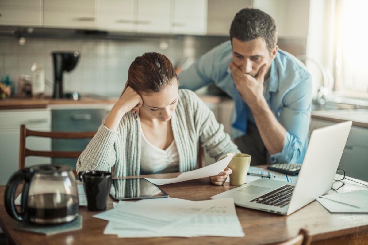 Couple upset at bills. Photography by Geber86 via Shutterstock