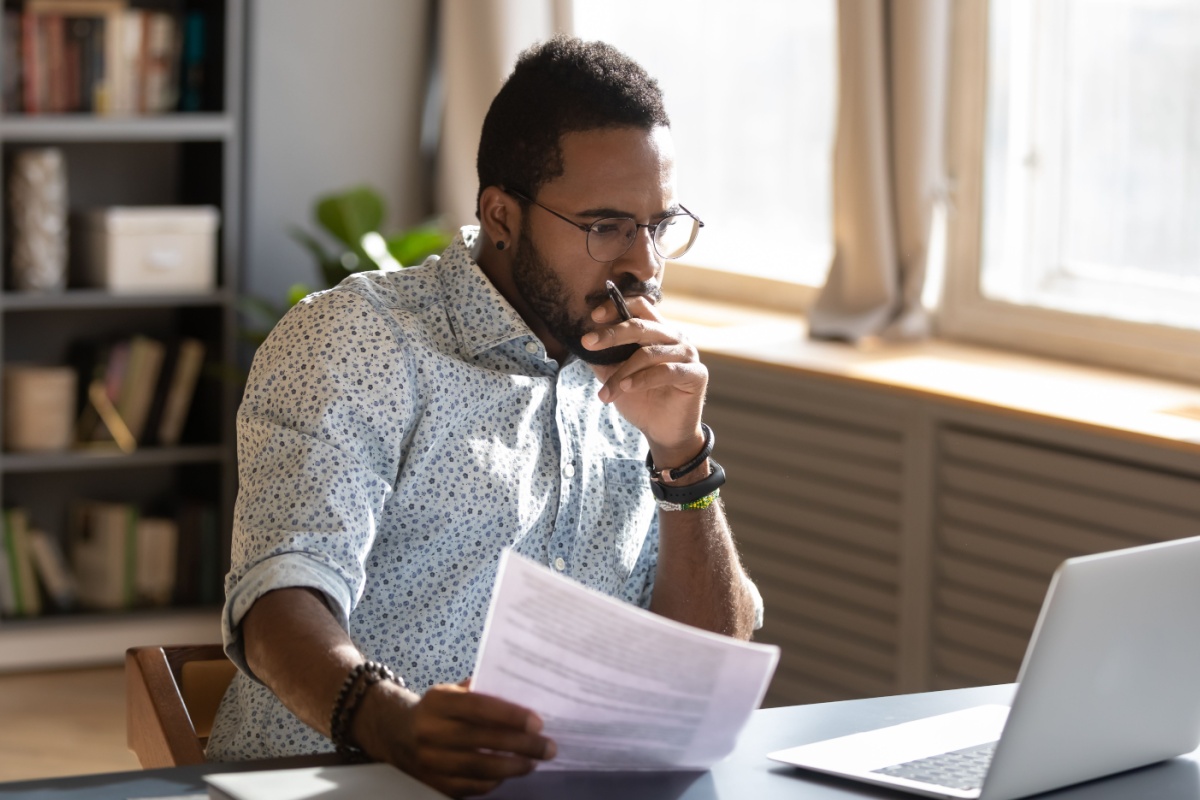 Person looking at computer. Photography by fizkes via Shutterstock