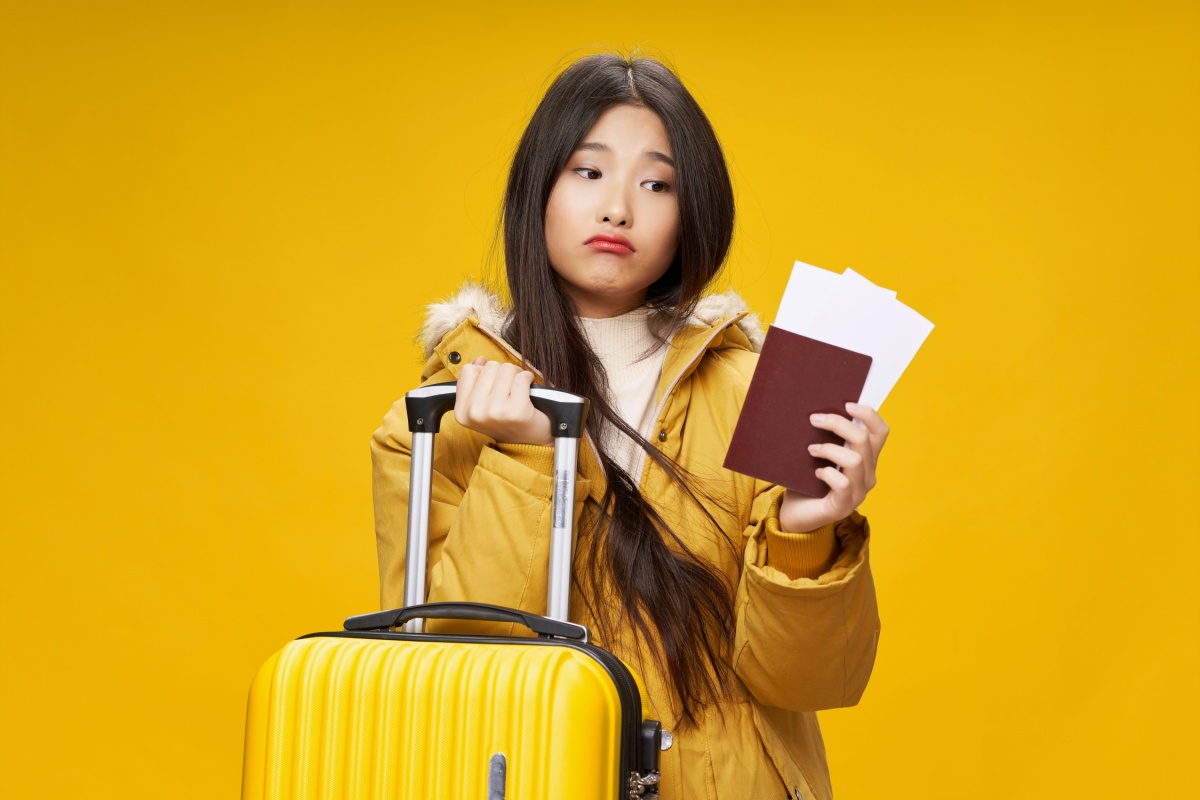 Woman traveller upset. Photography by ShotPrime Studio via Shutterstock