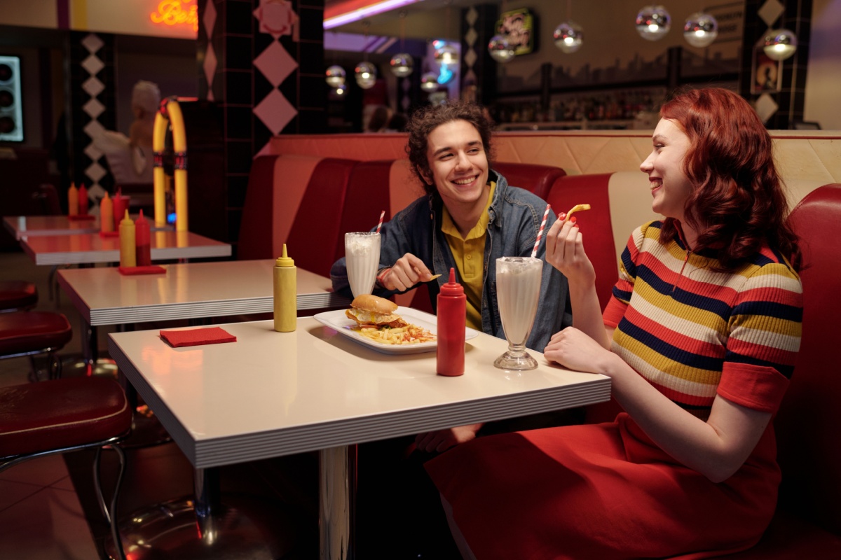 Friends at American Diner. Photography by Pressmaster via Shutterstock