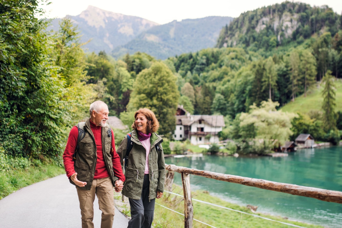 Senior couple walking together. Photography by Ground Picture via Shutterstock