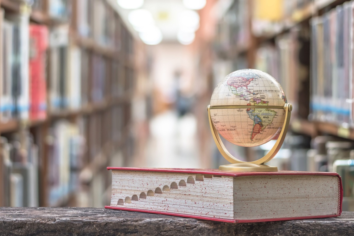 Atlas on top of book. Photography by Chinnapong via Shutterstock